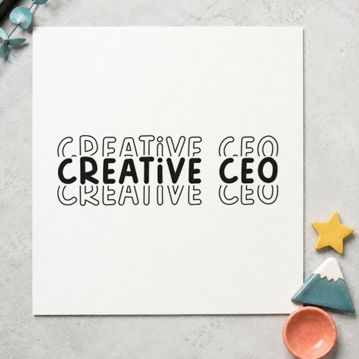 Creative CEO Repeated Lettering craft stamp in black ink on cardstock, an easy option for shop album page.