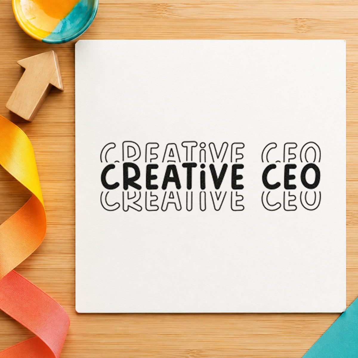 Creative CEO Repeated Lettering craft stamp imprint in black ink on a handmade project, one idea being sticker pack gift tags.