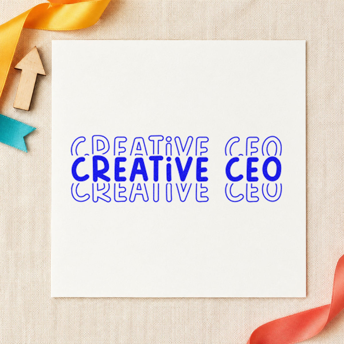 Creative CEO Repeated Lettering craft stamp imprinted in blue ink on paper, a design suited to framed press room.