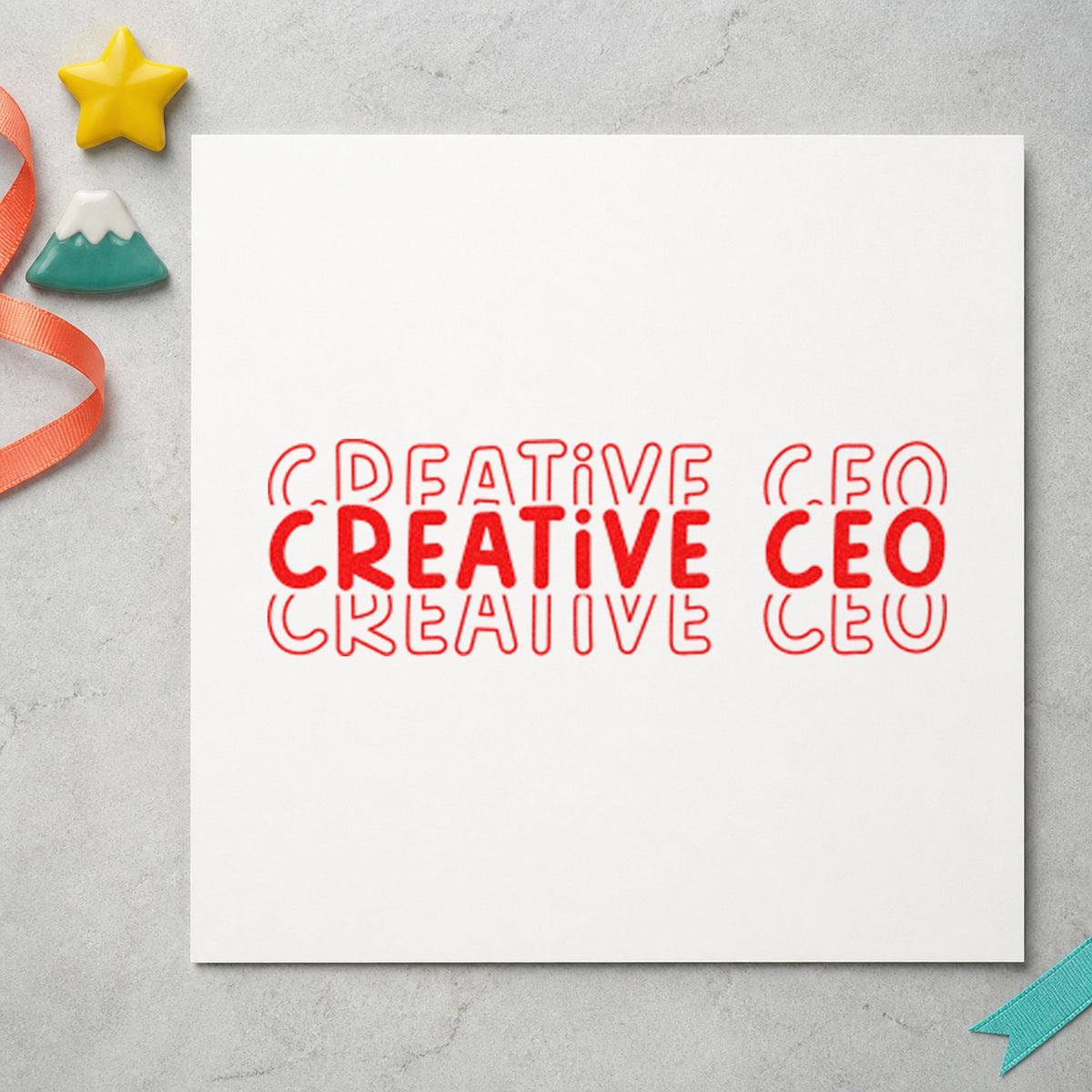 Creative CEO Repeated Lettering rubber stamp shown in red ink, stamped for projects such as rack screen labels.