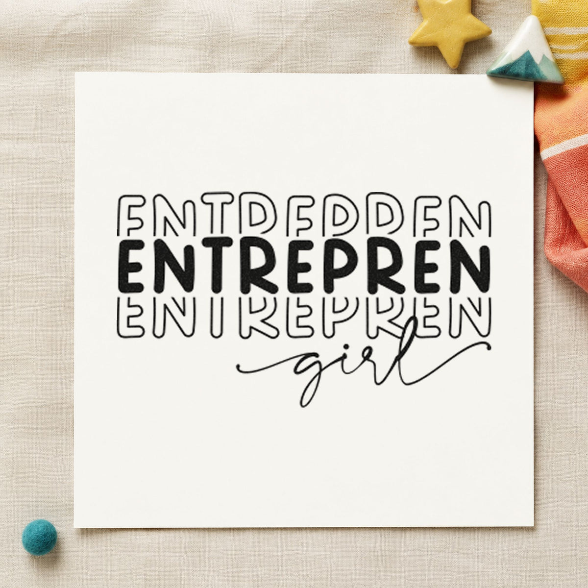 Entrepren Girl Repeated Lettering craft stamp imprint in black ink on a handmade project, one idea being monthly box gift tags.