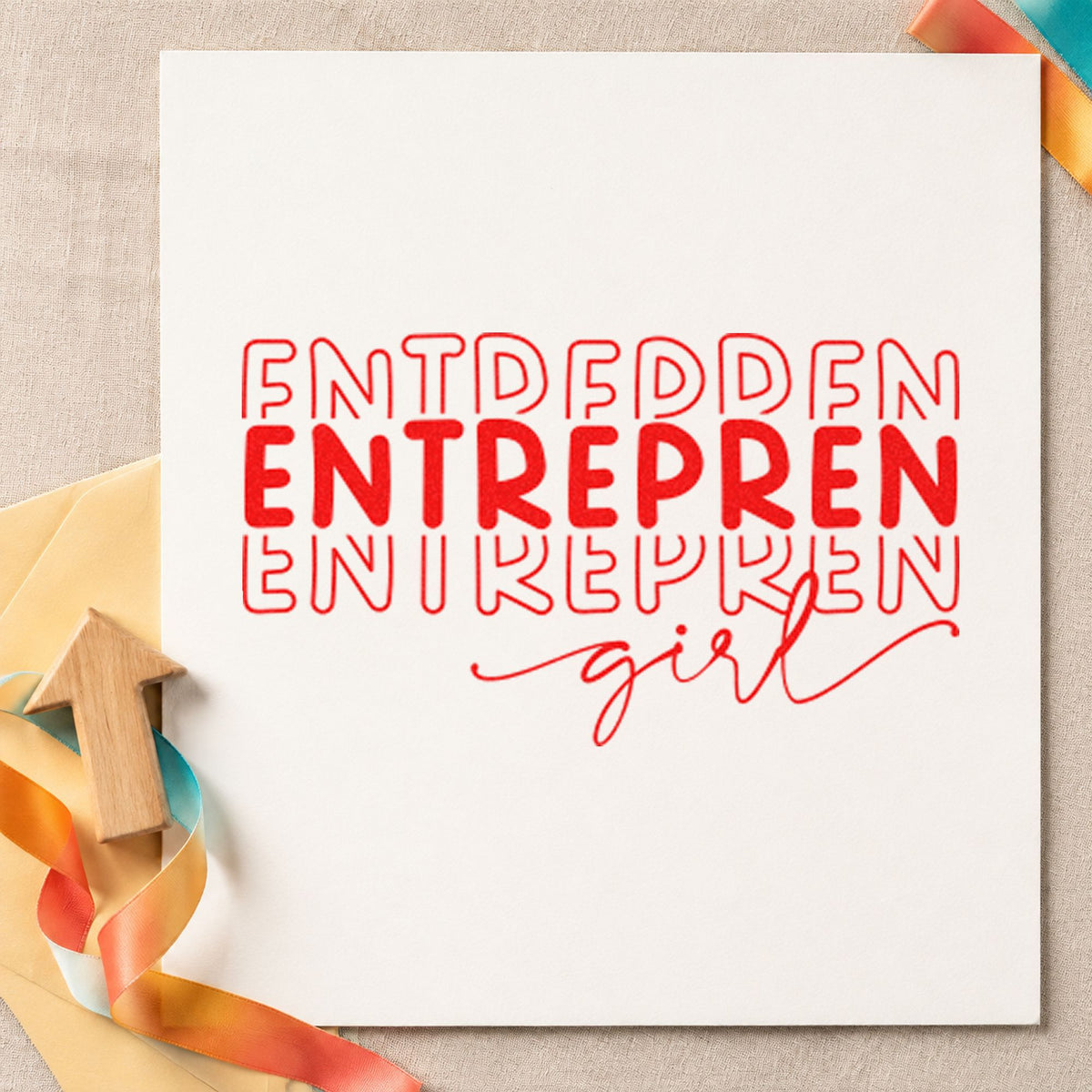 Entrepren Girl Repeated Lettering craft stamp imprint in red ink on a handmade project, one idea being insert note cards.