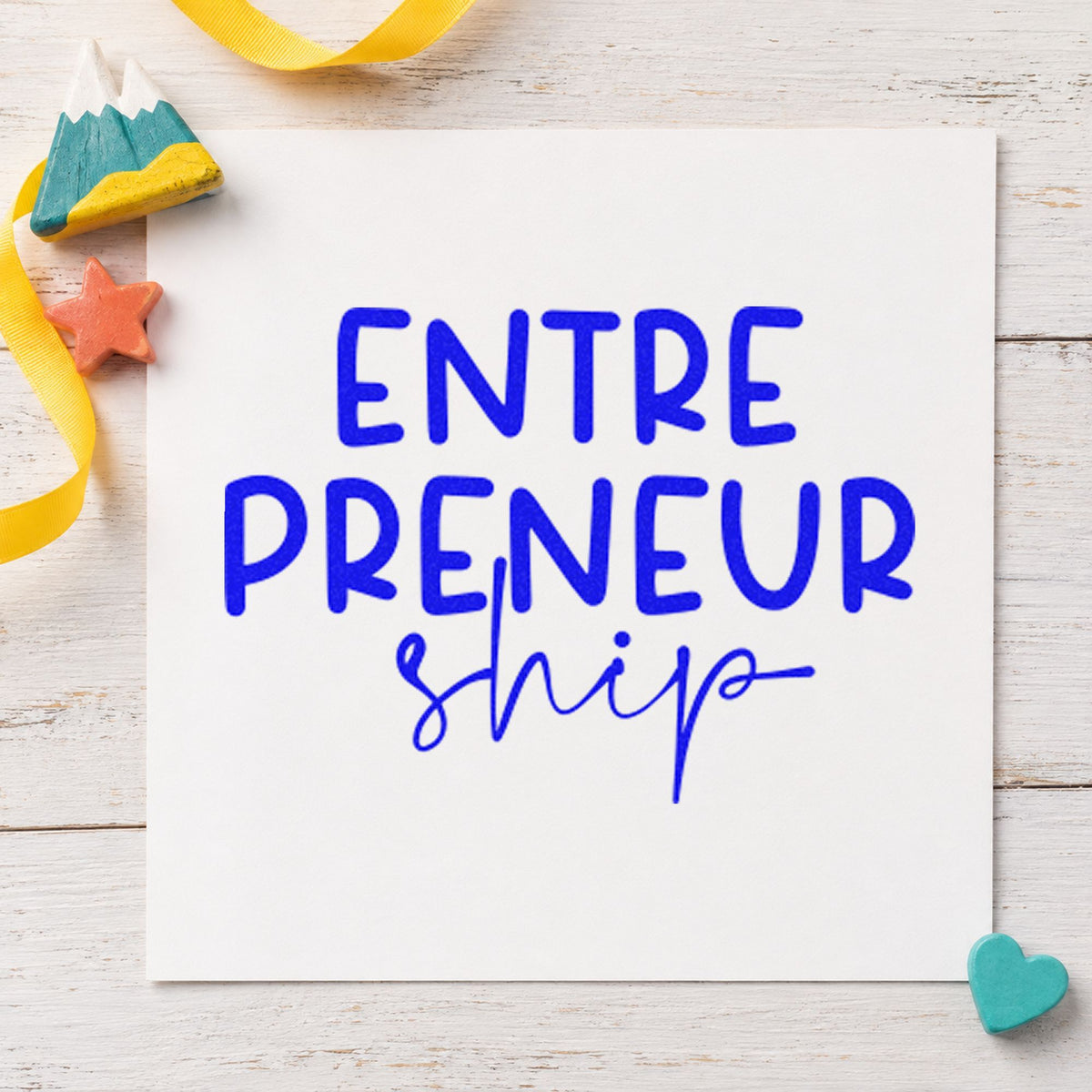 Entrepreneurship Split Lettering craft stamp imprinted in blue ink on paper, a design suited to framed loading door.