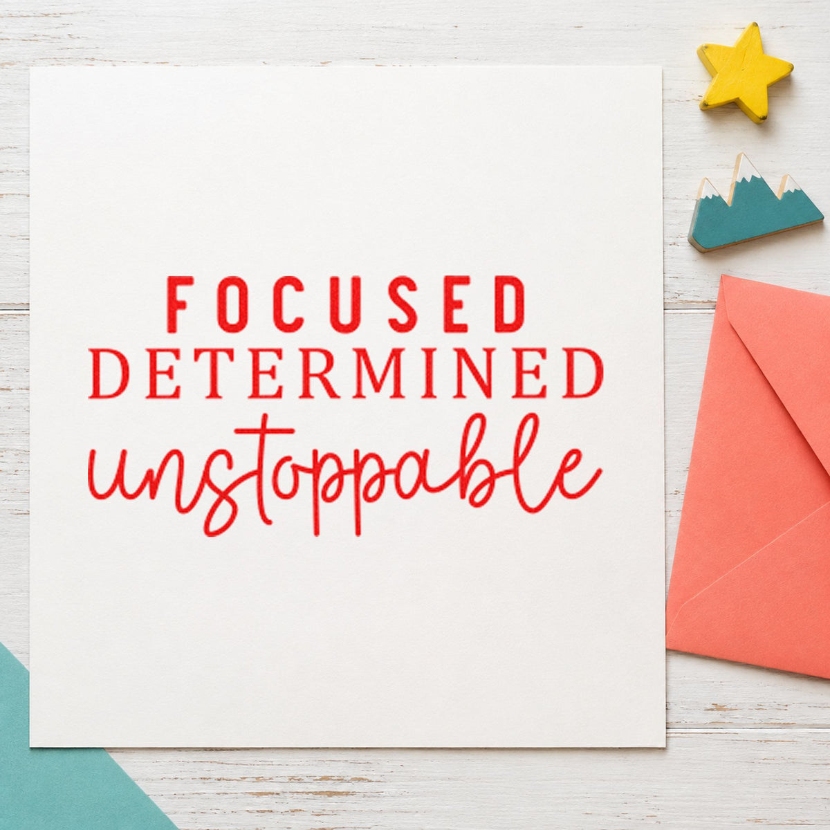 Focused Determined Unstoppable craft stamp imprint in red ink on a handmade project, one idea being deadline note cards.