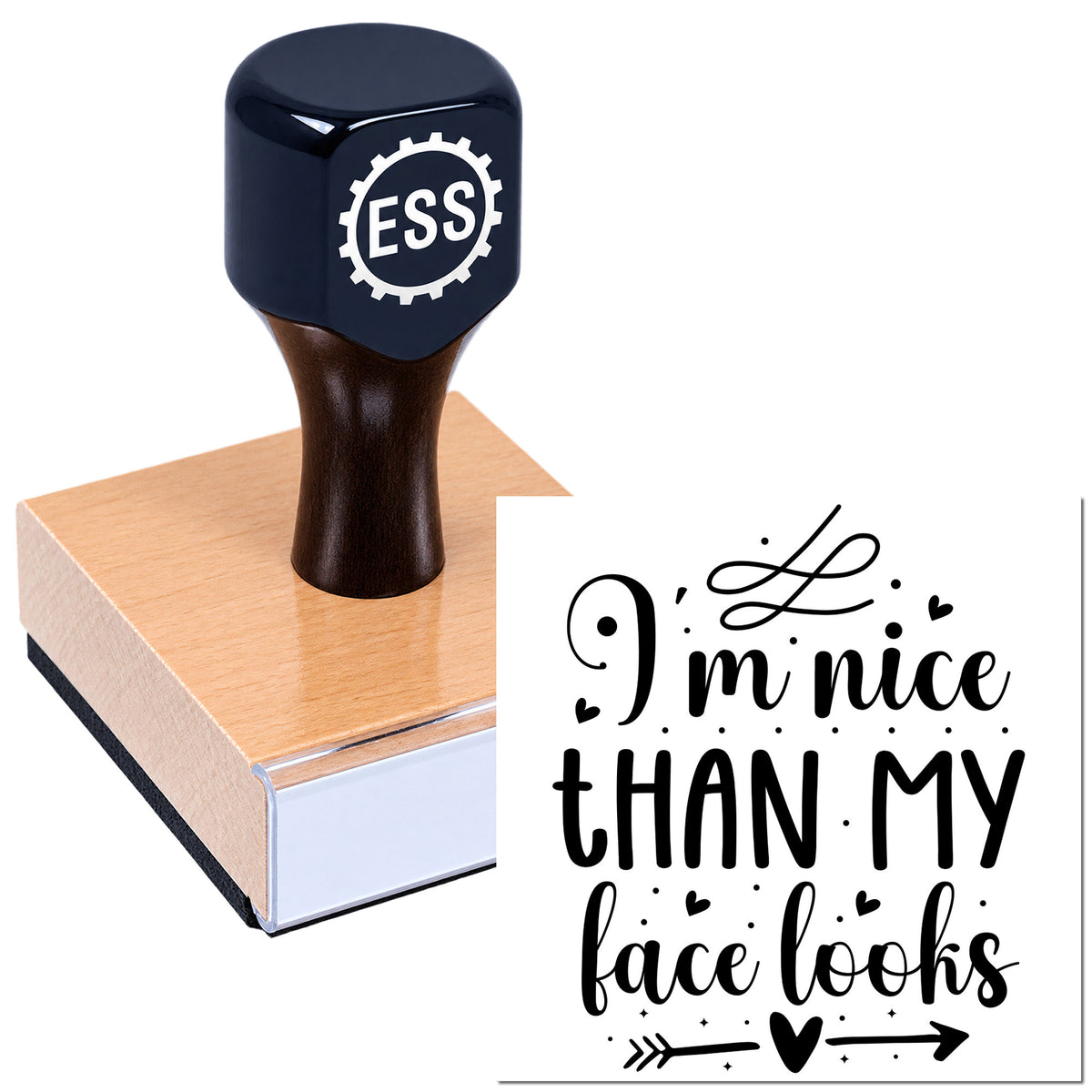 Navy ESSI rubber stamp on a pink wooden block beside a black decorative seal reading "I'm nice than my face looks."