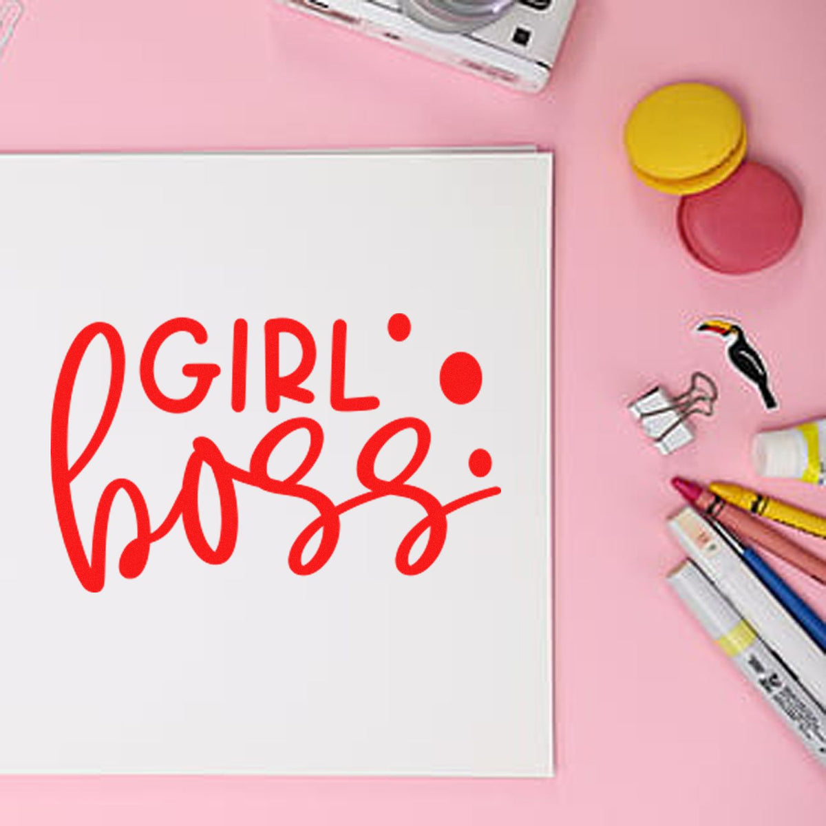 Red GIRL boss stamp on white card, with pink and yellow seal pads, markers, and a pink background.