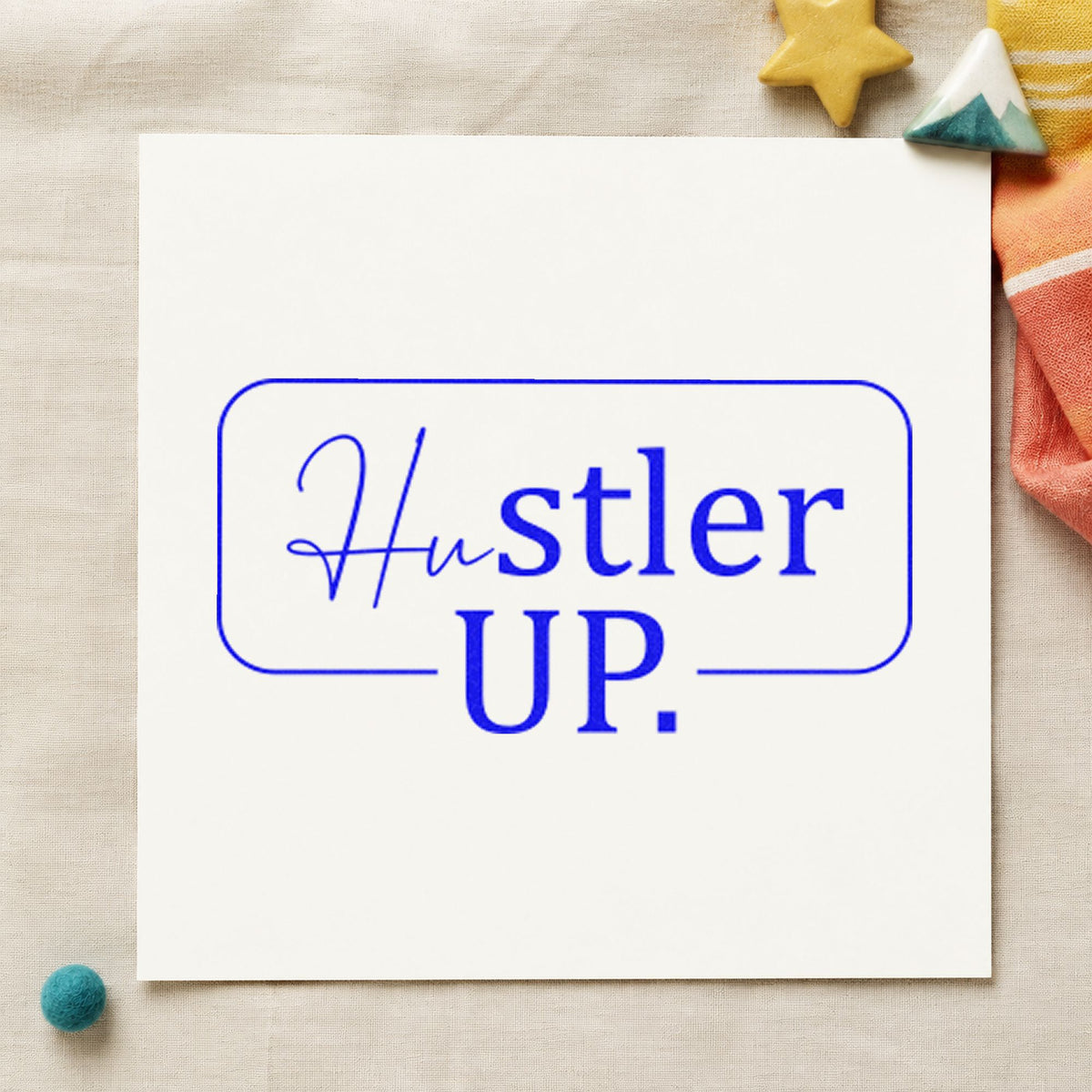 Hustler Up Rounded Frame craft stamp imprinted in blue ink on paper, a design suited to framed trailer wall.
