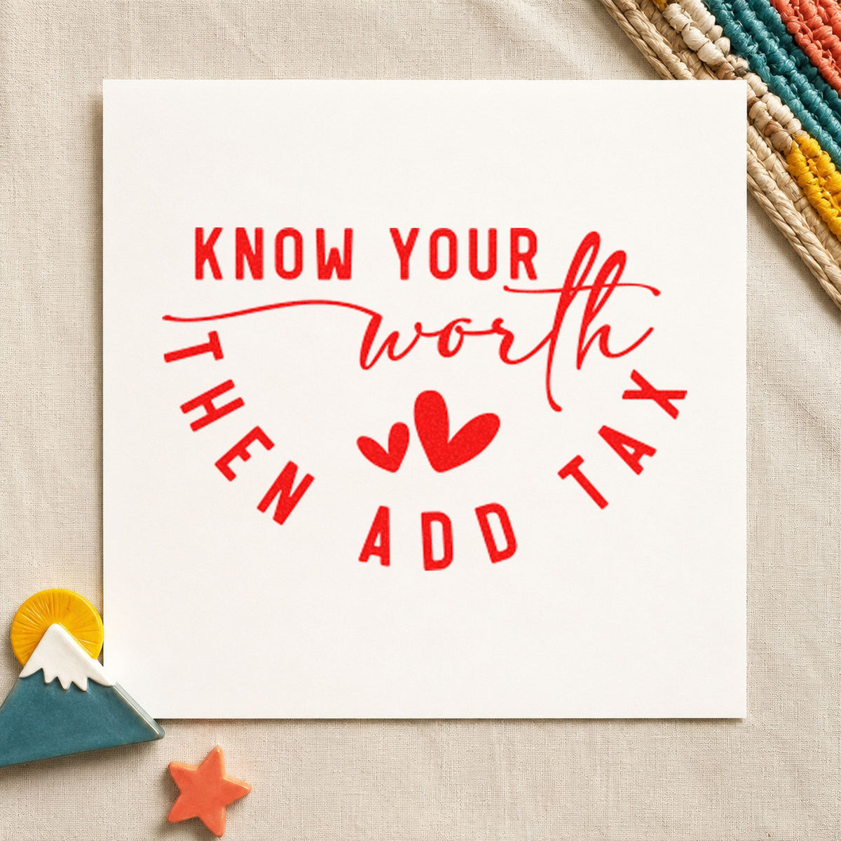 Know Your Worth Add Tax craft stamp imprint in red ink on a handmade project, one idea being care note cards.