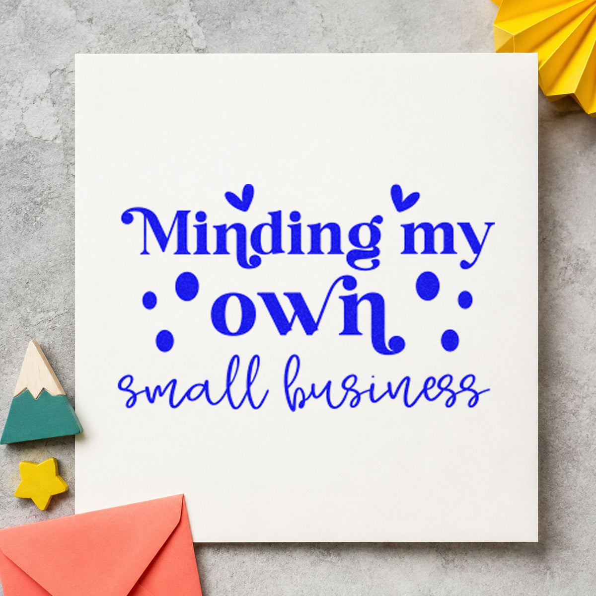 Minding My Own Small Business craft stamp in blue ink on cardstock, an easy option for baking apron printing.