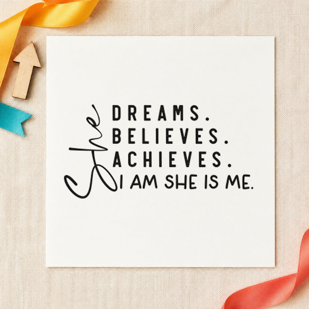 She Dreams Believes Achieves craft stamp imprint in black ink on a handmade project, one idea being artwork gift tags.