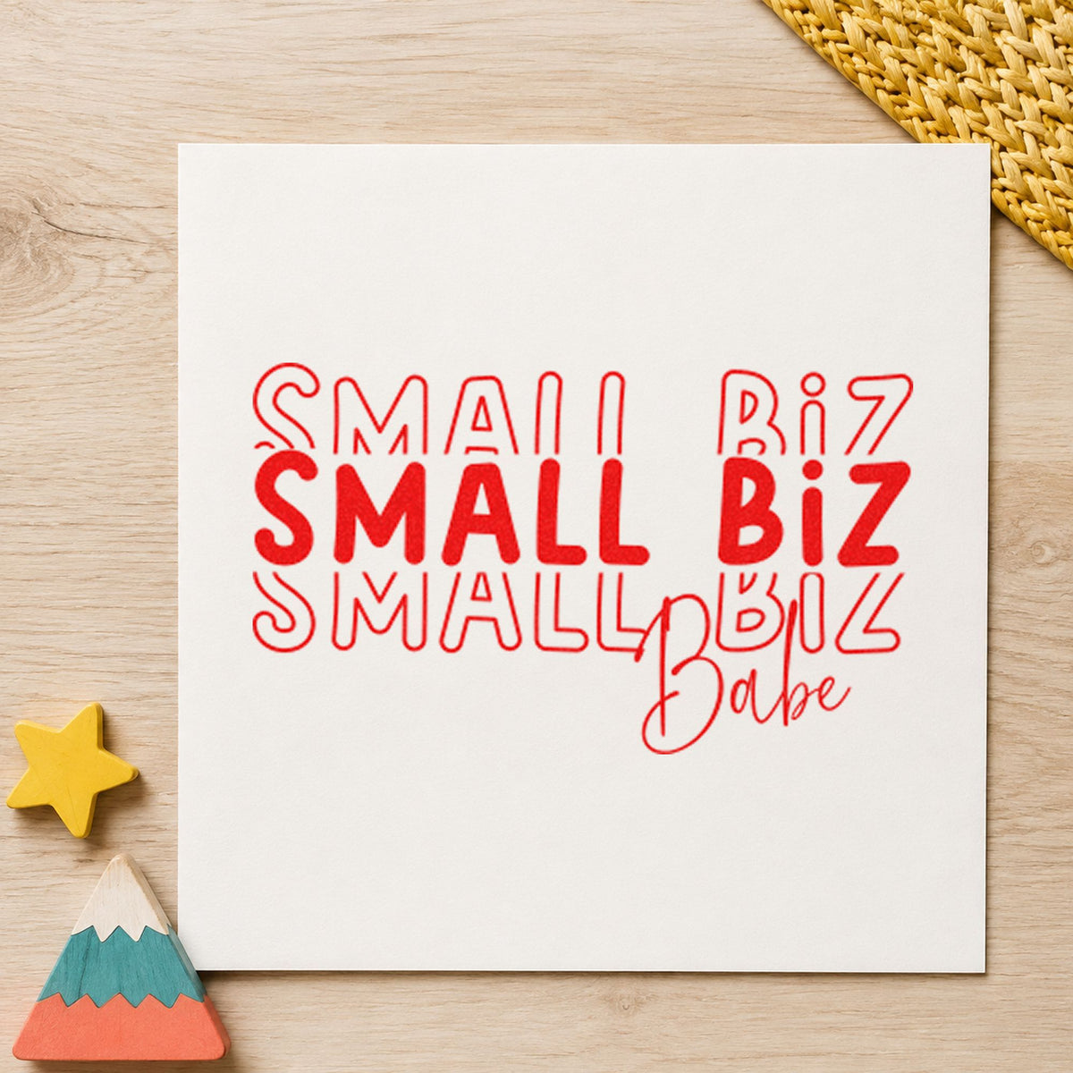 Small Biz Babe Repeated craft stamp imprint in red ink on a handmade project, one idea being polish note cards.