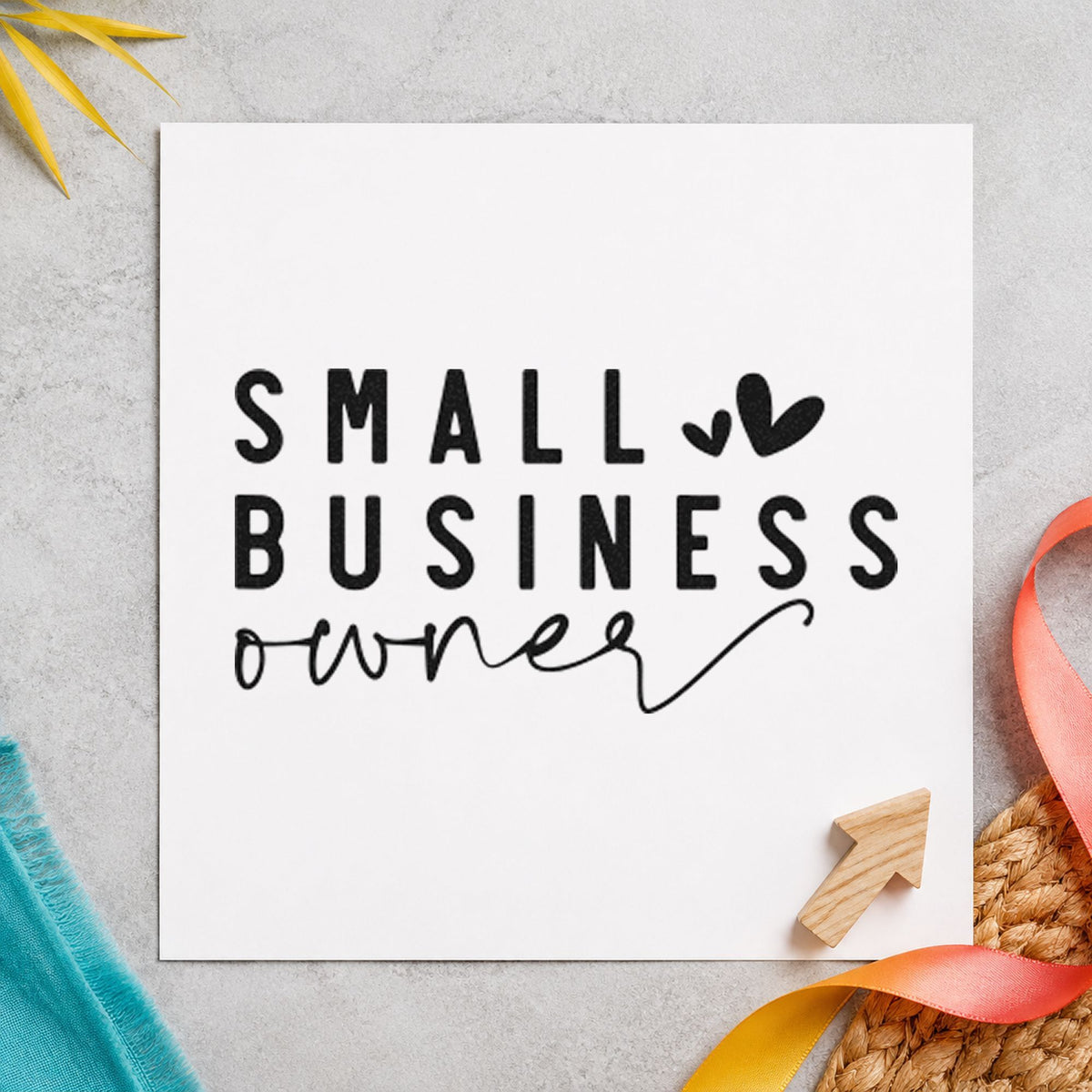 Small Business Owner Hearts craft stamp imprint in black ink on a handmade project, one idea being build gift tags.