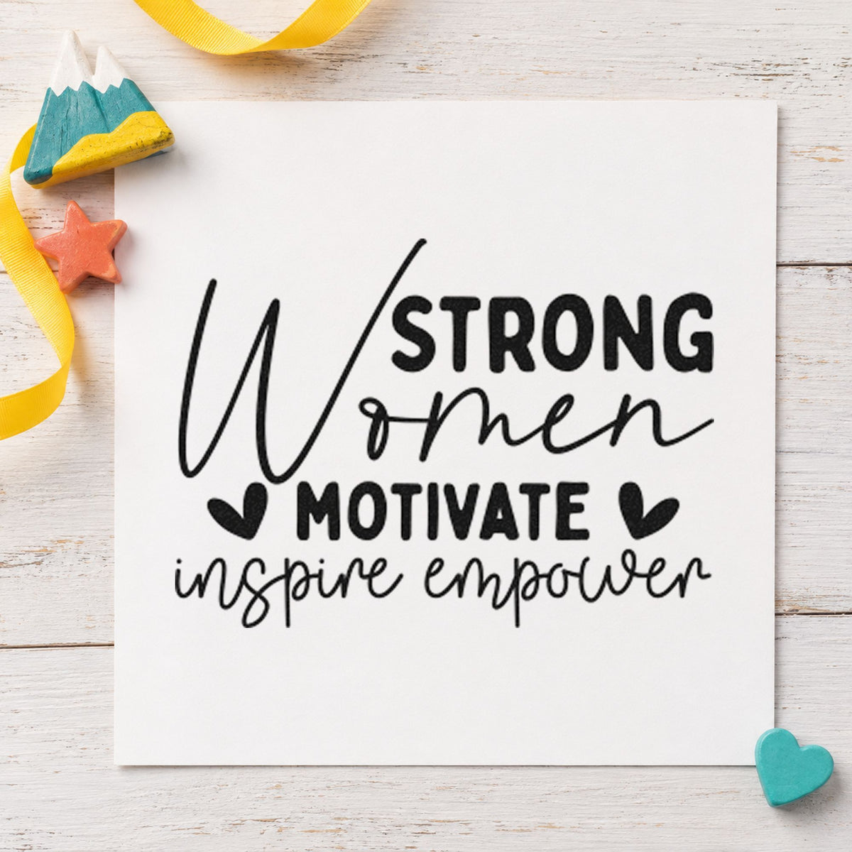Strong Women Motivate Inspire craft stamp imprint in black ink on a handmade project, one idea being share box gift tags.