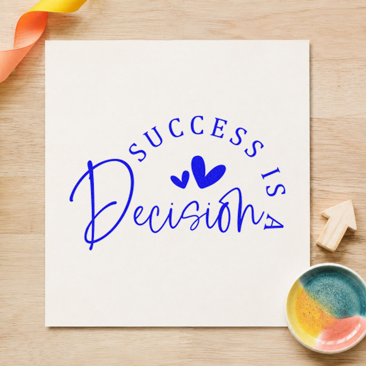 Success Is a Decision craft stamp imprinted in blue ink on paper, a design suited to framed study room.