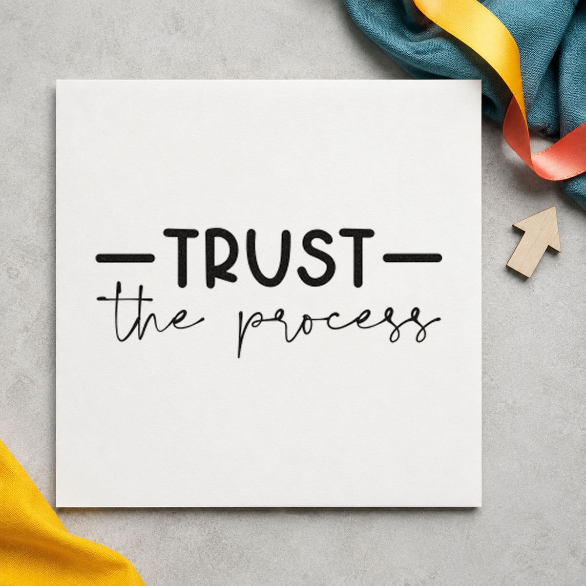Trust The Process Script craft stamp imprint in black ink on a handmade project, one idea being leather gift tags.
