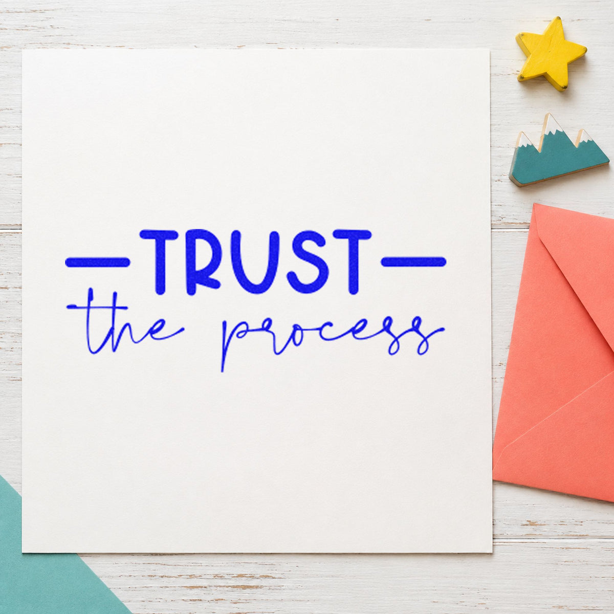 Trust The Process Script craft stamp imprinted in blue ink on paper, a design suited to framed cutting table.
