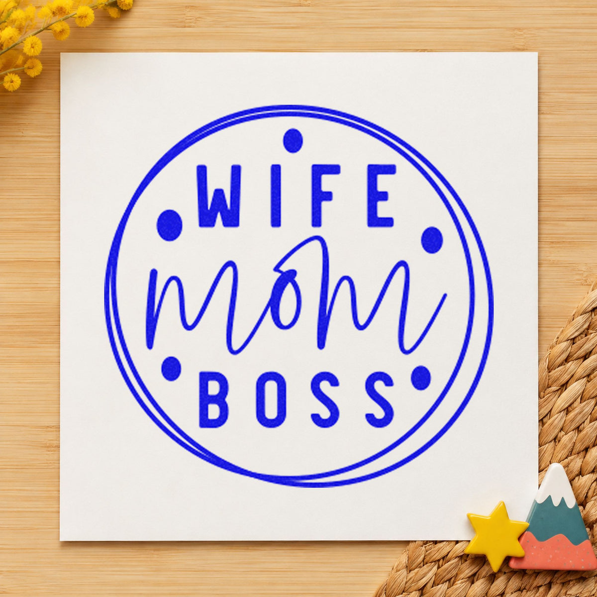 Wife Mom Boss Circle craft stamp imprinted in blue ink on paper, a design suited to framed home studio.