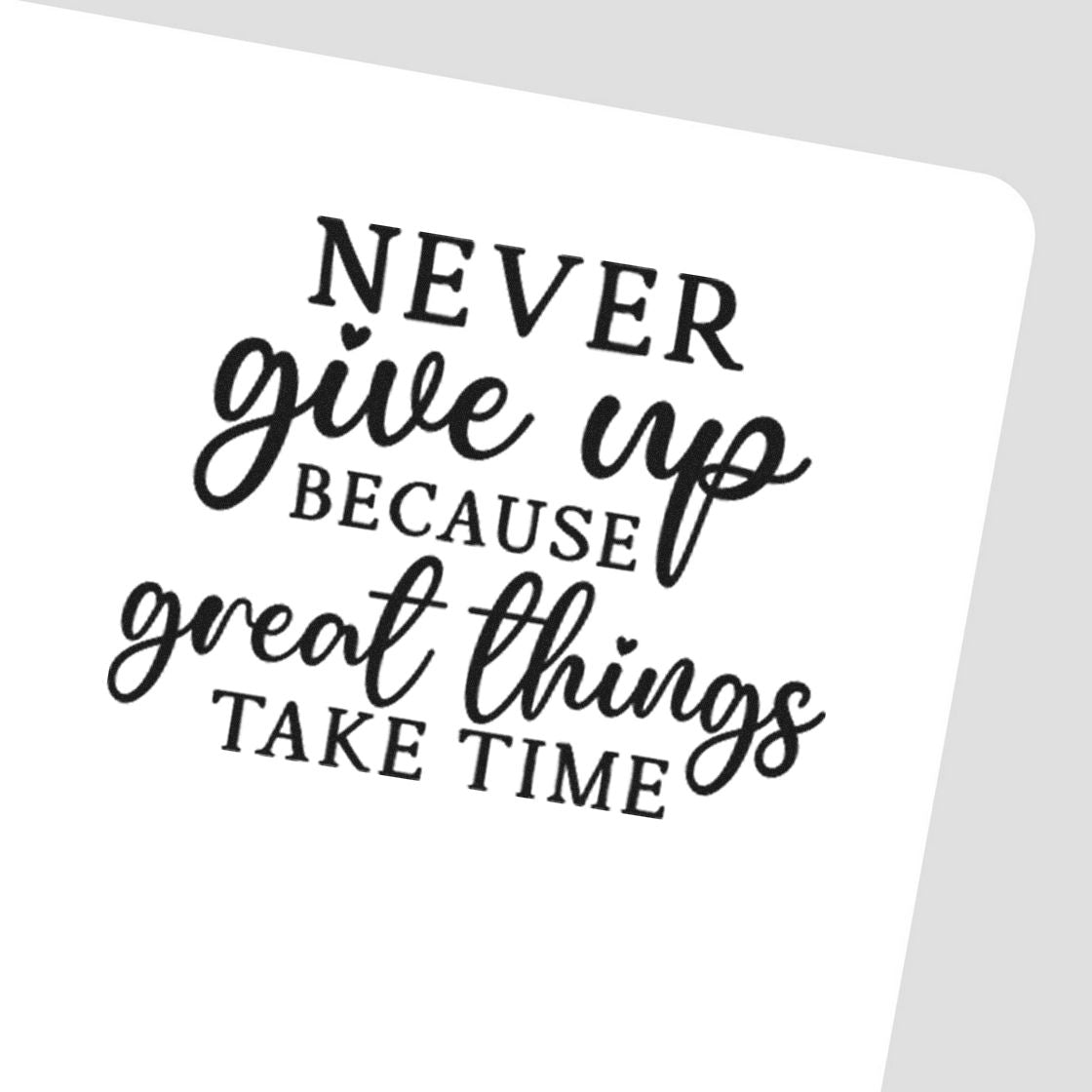 Black motivational rubber stamp on white card reads Never give up because great things take time in script and serif type.