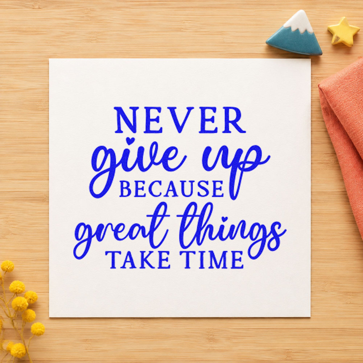Never Give Up Great Things craft stamp in blue ink on cardstock, an easy option for site banner printing.