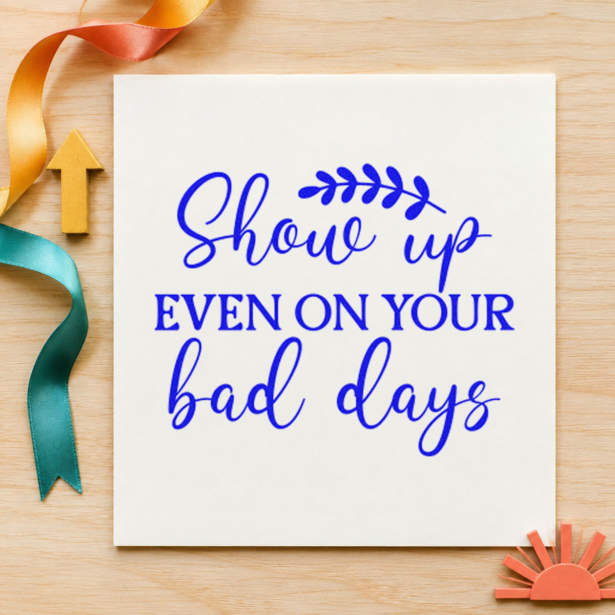 Show Up On Bad Days craft stamp in blue ink on cardstock, an easy option for pencil case printing.