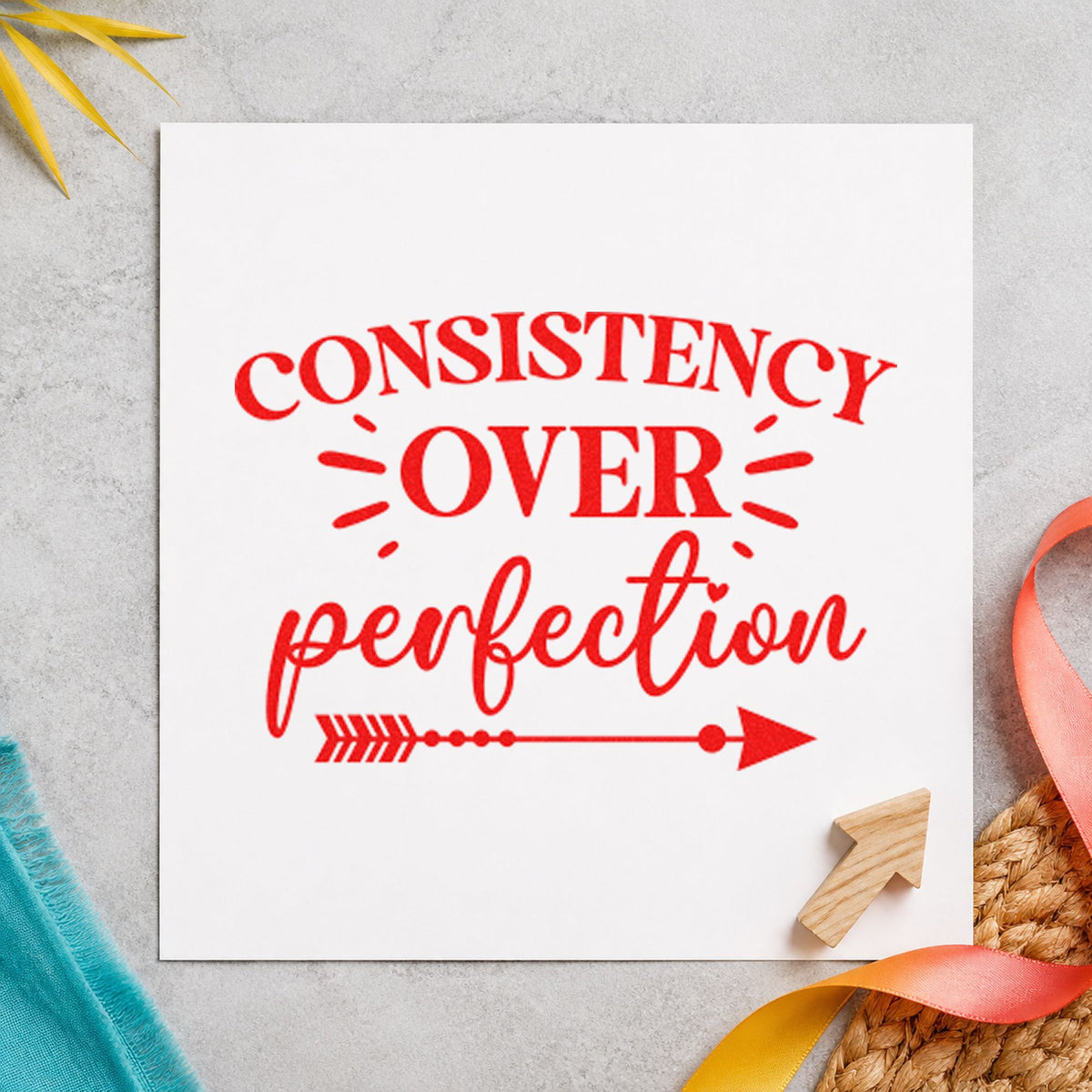 Consistency Over Perfection Arrow rubber stamp shown in red ink, stamped for projects such as box flashcard labels.