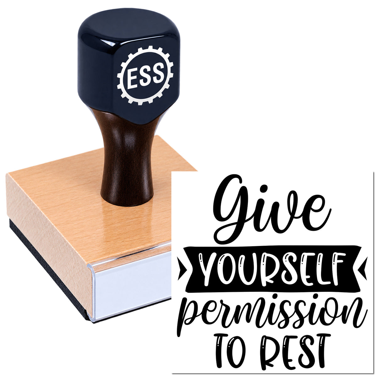 Black ESS seal stamp on a wooden block with quote "Give yourself permission to rest" in black script.