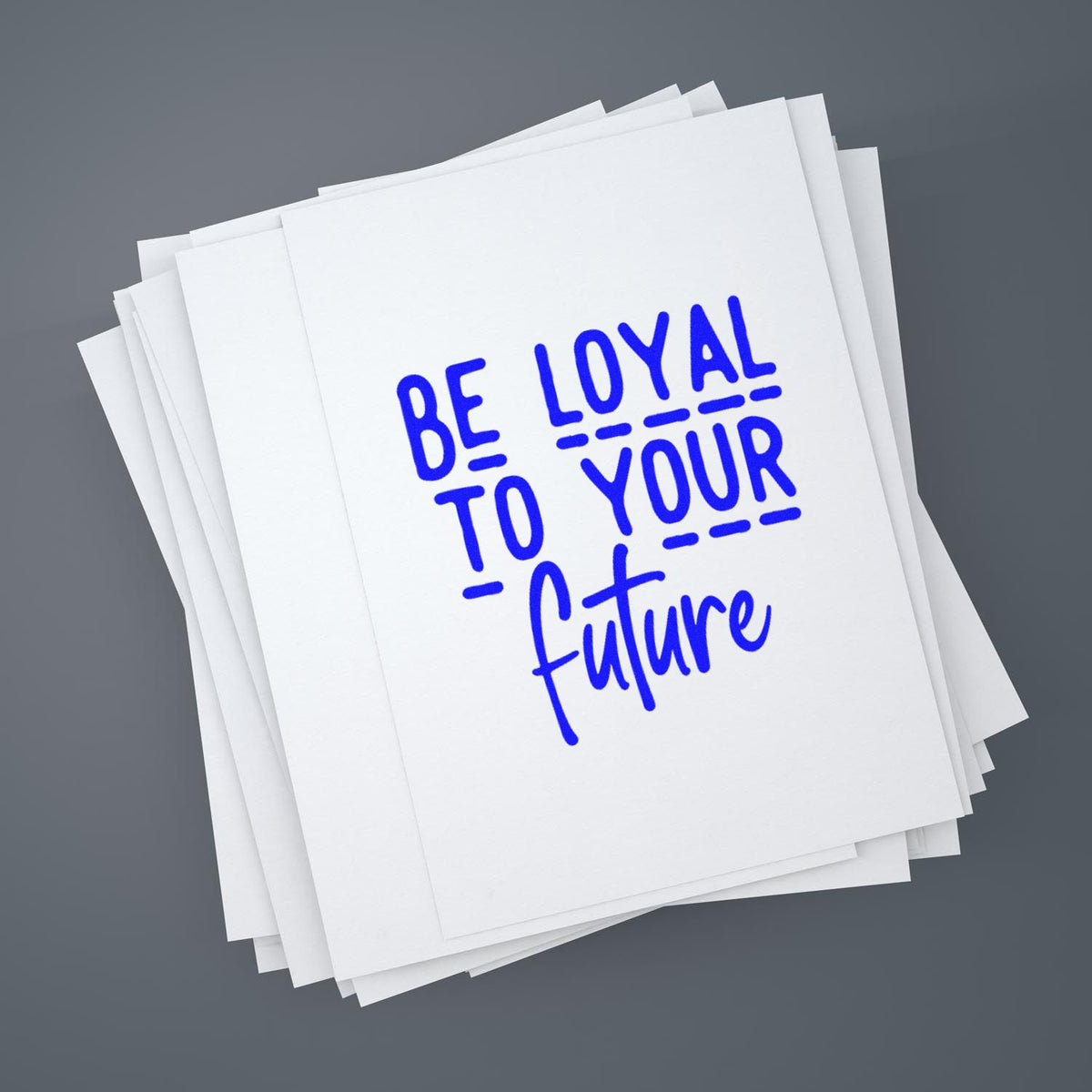 Stack of white stamp and seal cards with blue Be loyal to your future lettering on a gray background.