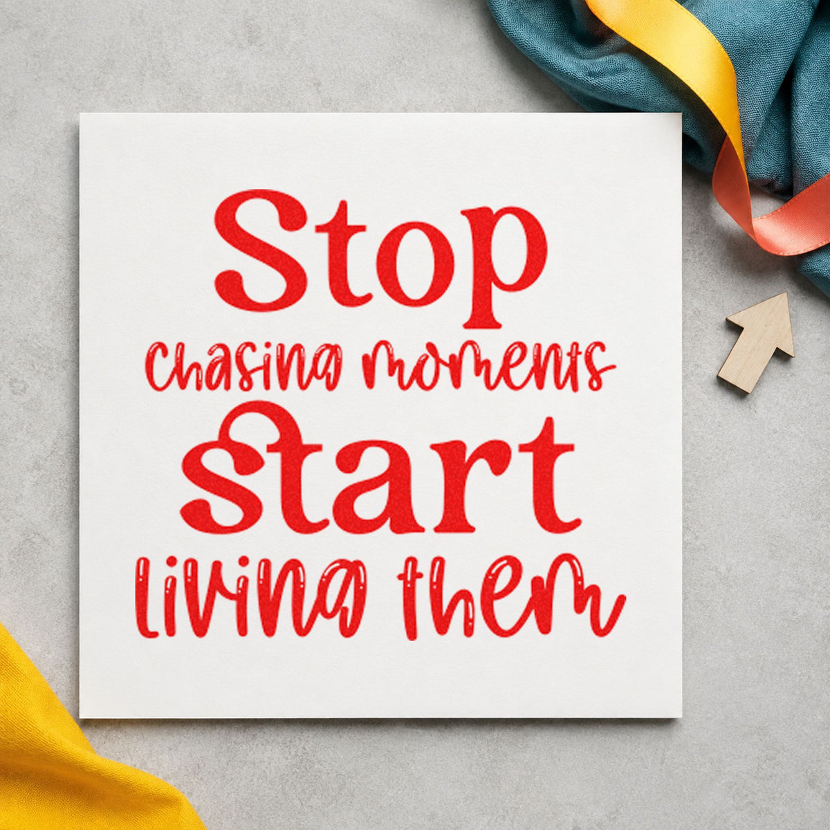 Stop Chasing Start Living craft stamp imprint in red ink on a handmade project, one idea being set list cards.