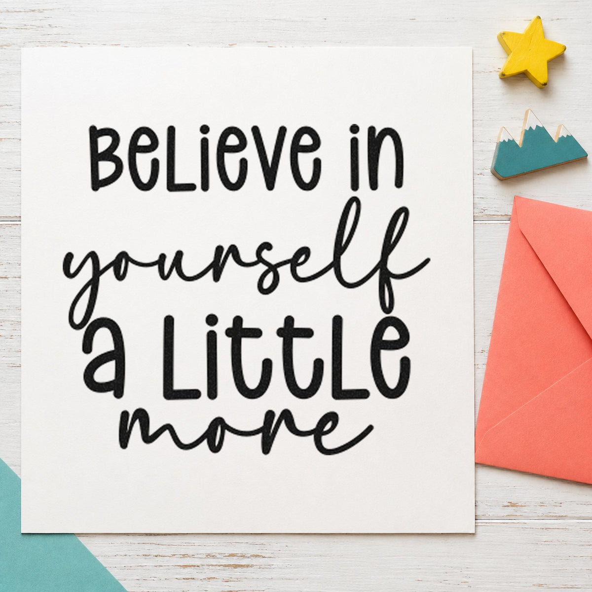 Believe Yourself A Little More craft stamp imprint in black ink on a handmade project, one idea being handout gift tags.