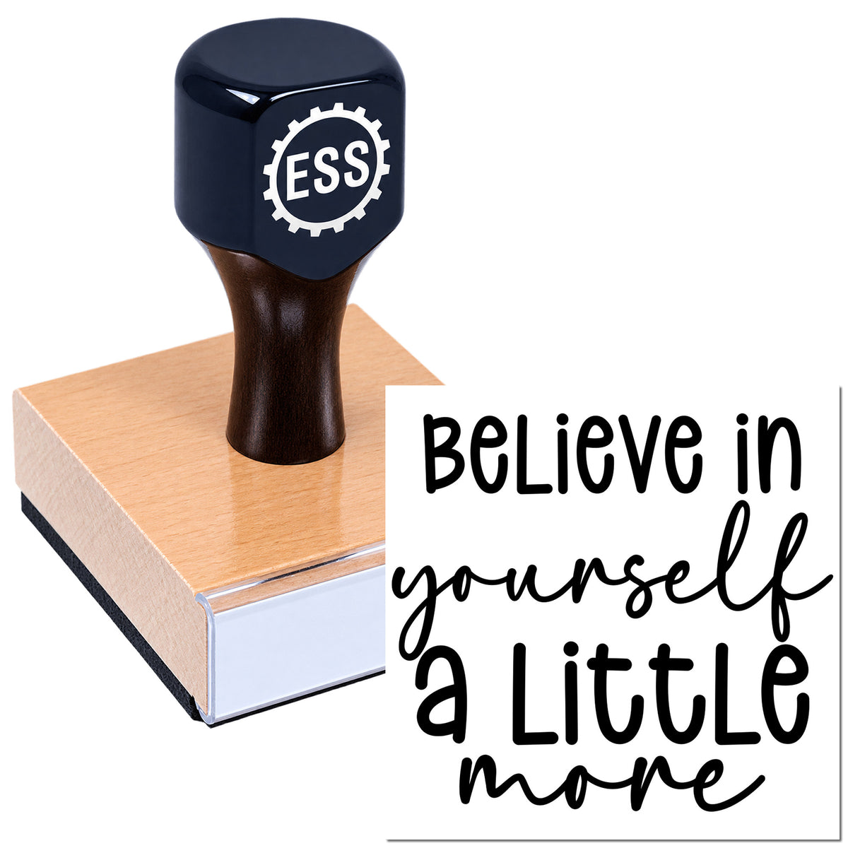 Dark blue ESS rubber stamp and seal on a pink block, with "Believe in yourself a little more" text.
