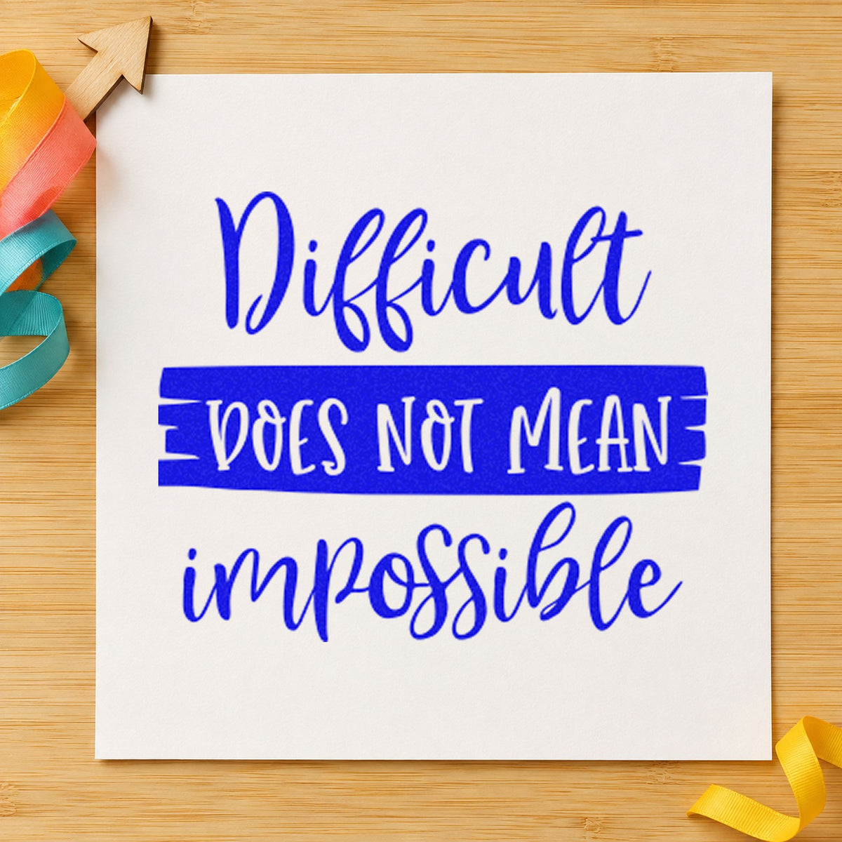 Difficult Does Not Mean Impossible craft stamp in blue ink on cardstock, an easy option for table cover printing.