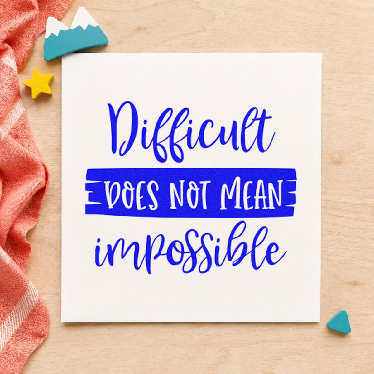 Difficult Does Not Mean Impossible craft stamp imprinted in blue ink on paper, a design suited to framed game shelf.