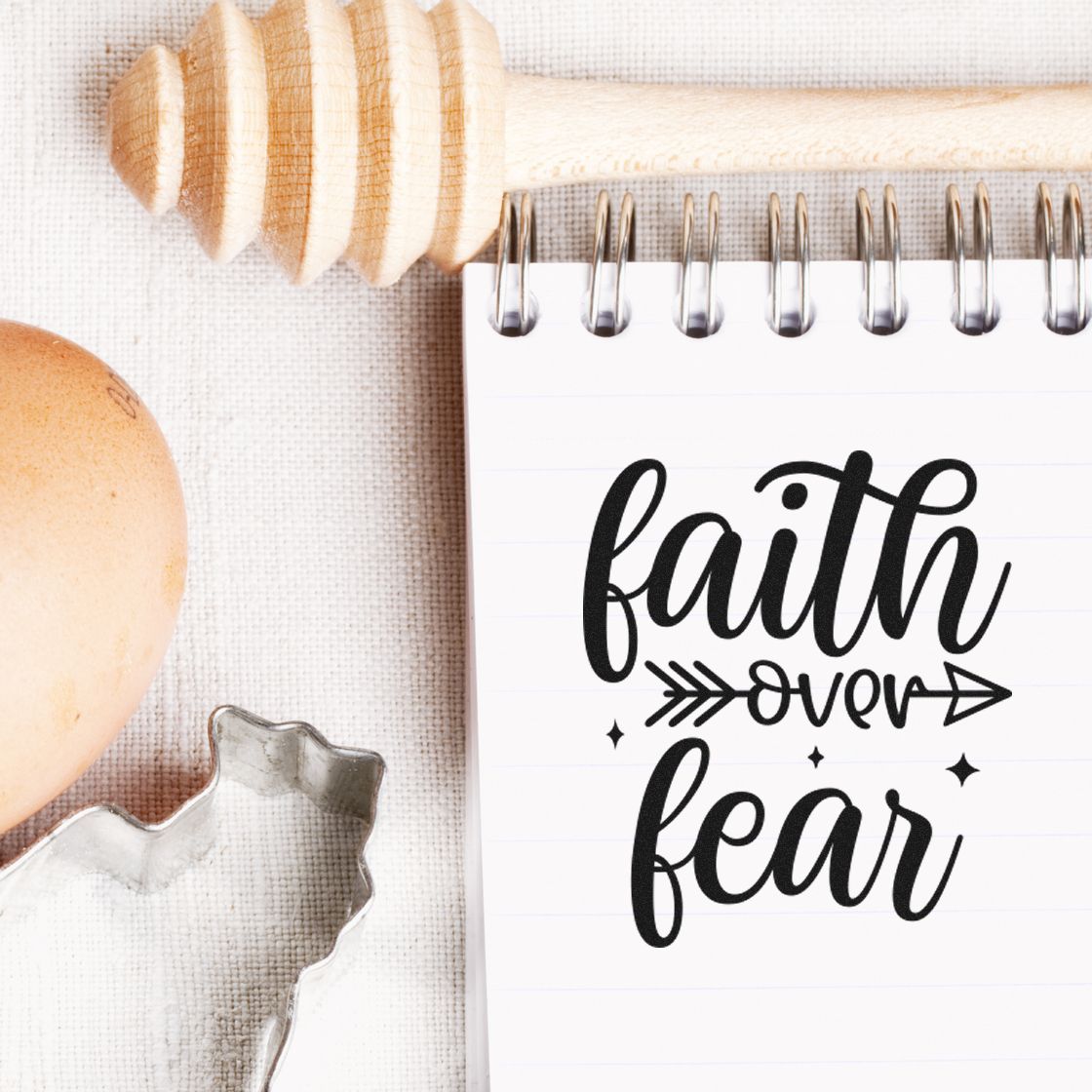 Faith Over Fear Arrow With Sparkles Premium Wooden Stamp - Vintage Pro imprint stamped in black ink. The words "faith over fear" appear in bold script with an arrow through "over" and small sparkles.