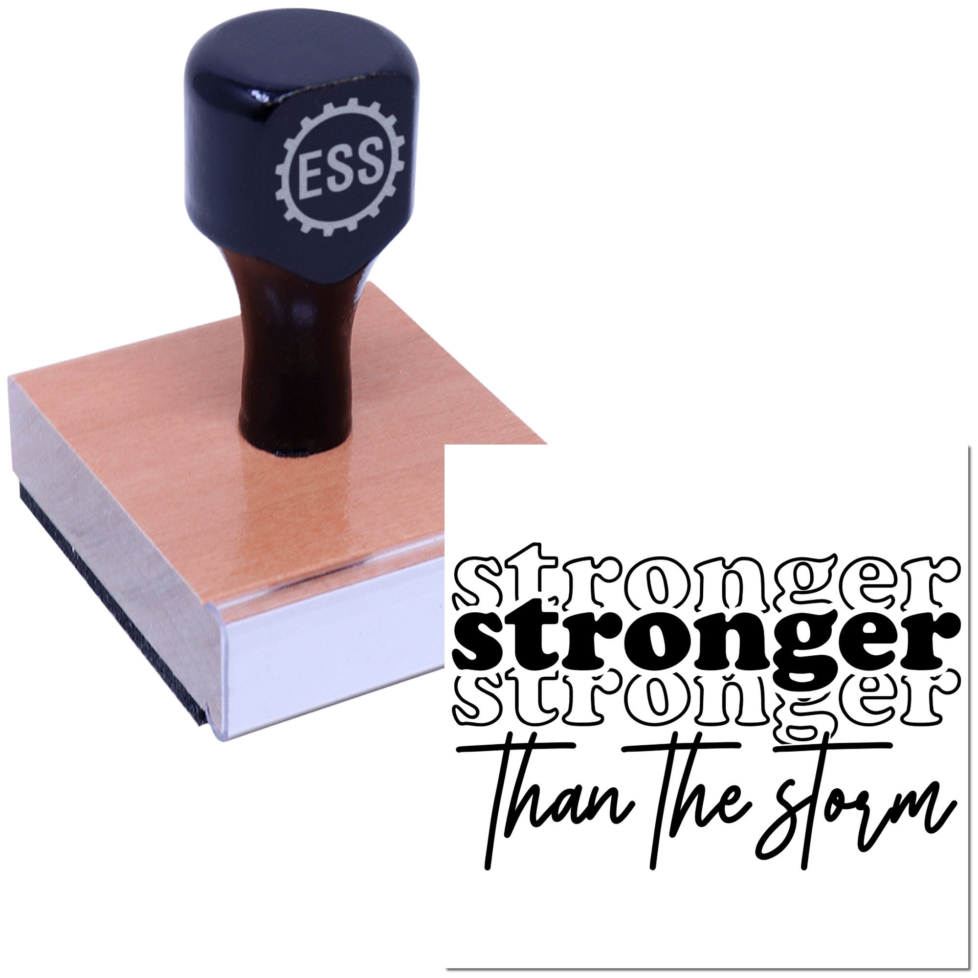 Black ESS seal stamp on a copper-toned wooden block with Stronger than the storm design