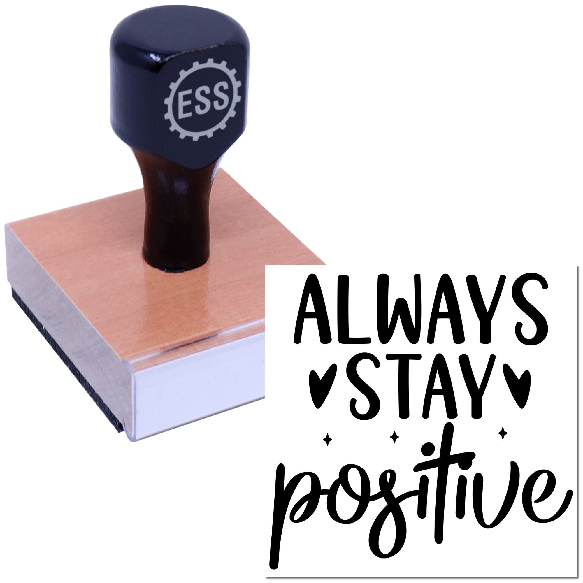 Navy ESSI stamp and seal on a wooden block with black Always stay positive lettering.