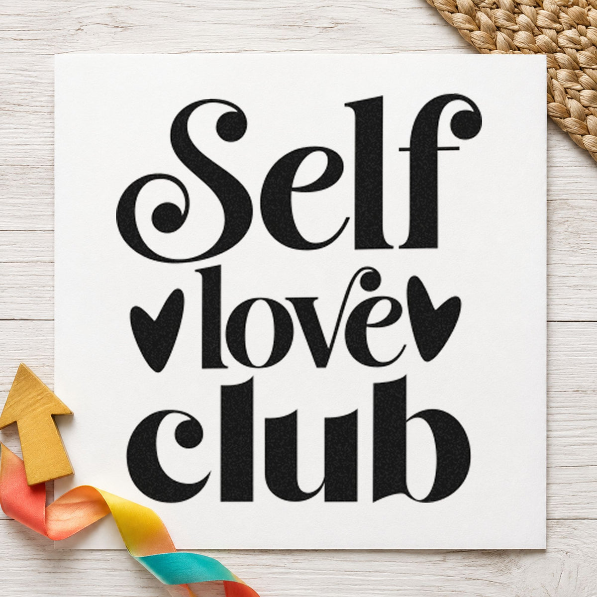 Self Love Club Hearts craft stamp imprint in black ink on a handmade project, one idea being polish set gift tags.