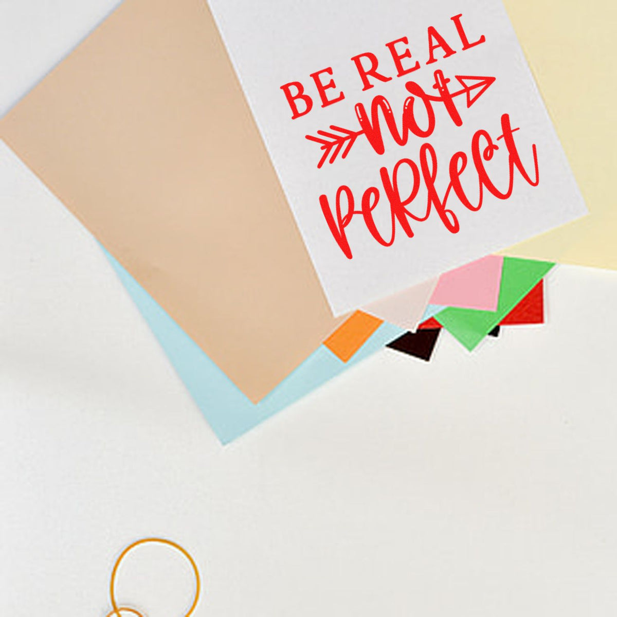 Red Be Real Not Perfect stamp on white card, layered with pastel seal sheets and colorful tabs.