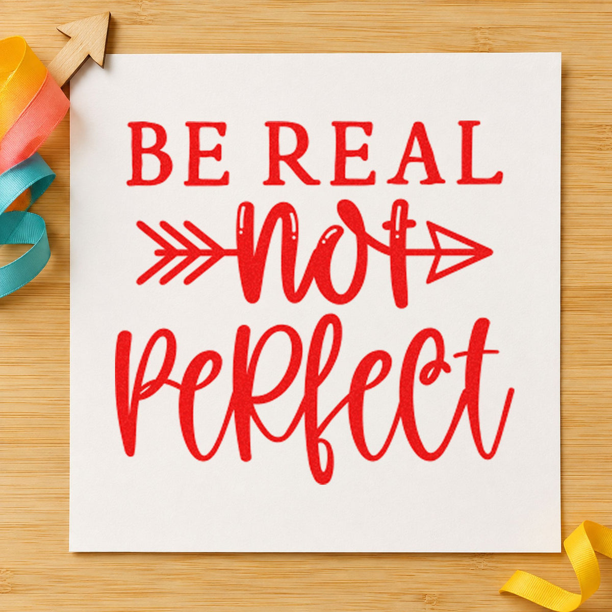 Be Real Not Perfect craft stamp imprint in red ink on a handmade project, one idea being recipe fail cards.