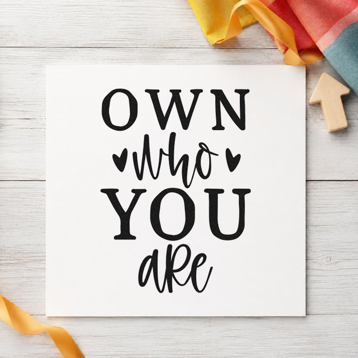 Own Who You Are craft stamp in black ink on cardstock, an easy option for rink season album page.