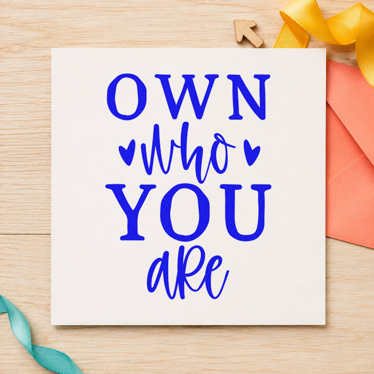 Own Who You Are craft stamp imprinted in blue ink on paper, a design suited to framed skate counter.