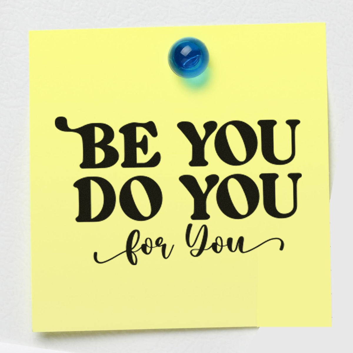 Yellow note with black stamp-style BE YOU DO YOU for You and blue pushpin, showcasing custom stamp and seal design.