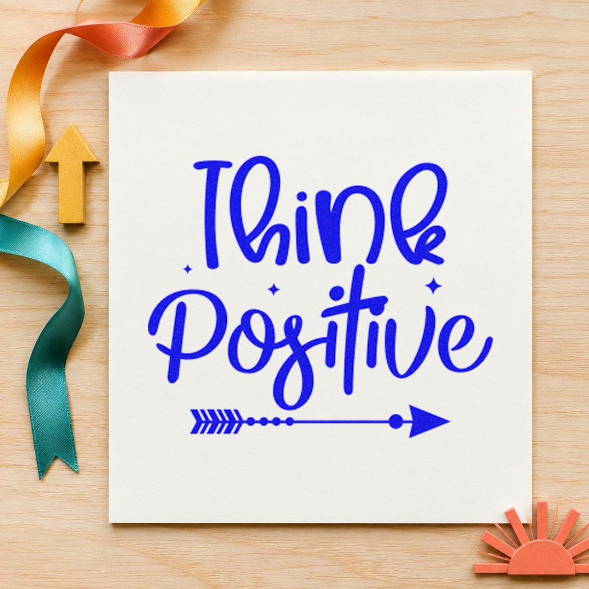 Think Positive Arrow craft stamp in blue ink on cardstock, an easy option for seat cover printing.