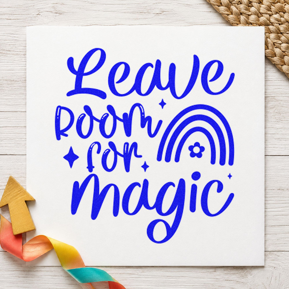 Leave Room For Magic Rainbow craft stamp in blue ink on cardstock, an easy option for play mat printing.