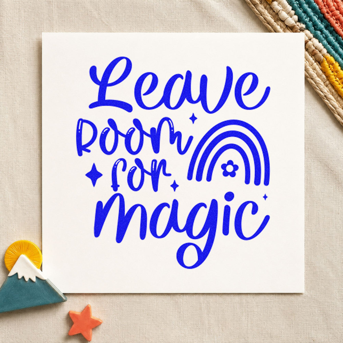 Leave Room For Magic Rainbow craft stamp imprinted in blue ink on paper, a design suited to framed window sill.