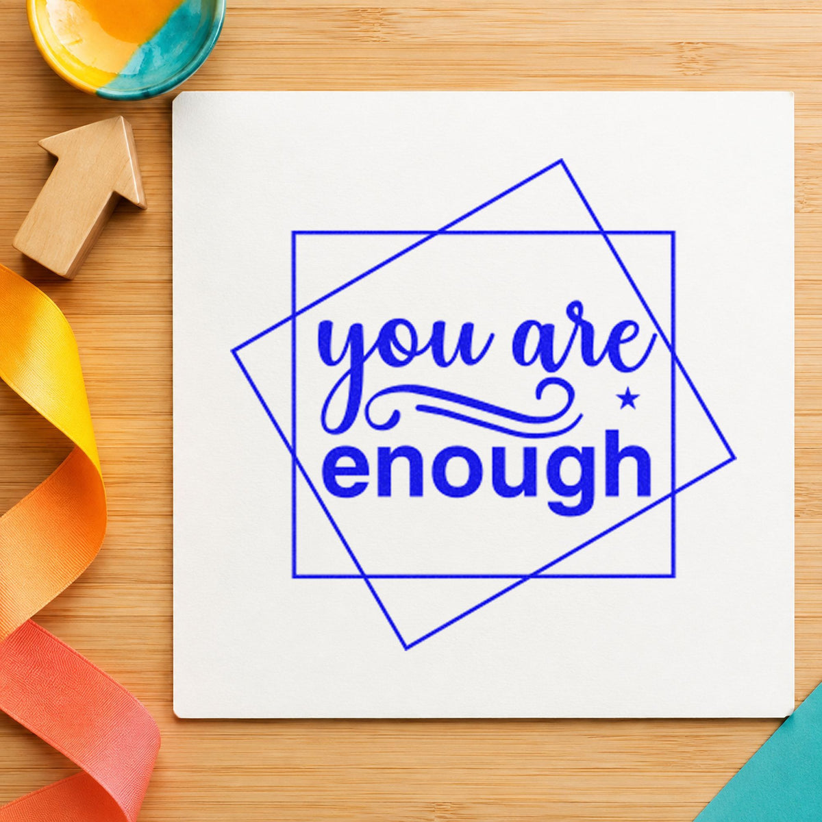 You Are Enough Overlapping Squares craft stamp in blue ink on cardstock, an easy option for dish towel printing.