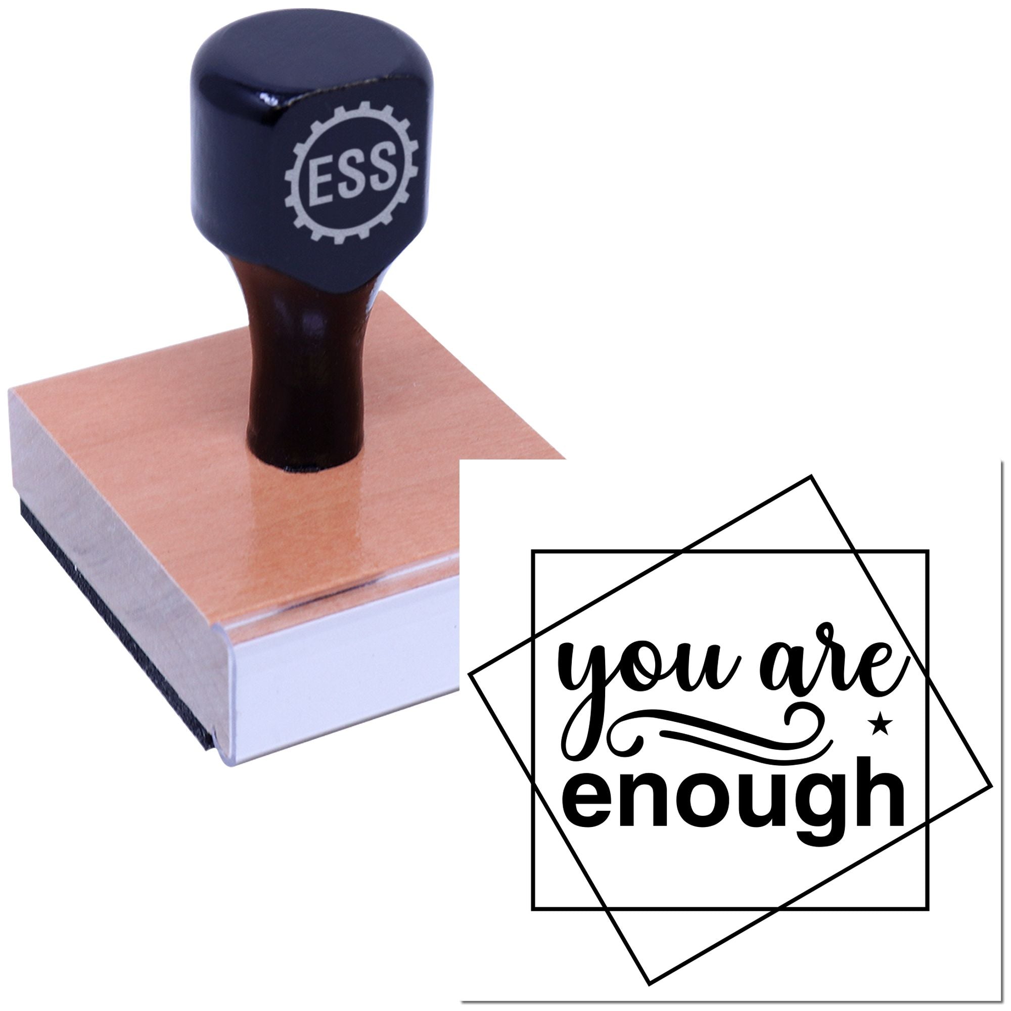 Navy ESS rubber stamp on copper-toned block with black you are enough seal design on white background.