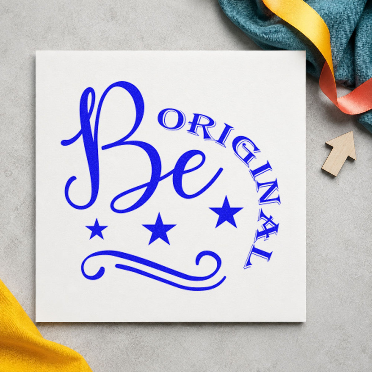 Be Original Stars Flourish craft stamp imprinted in blue ink on paper, a design suited to framed paint desk.