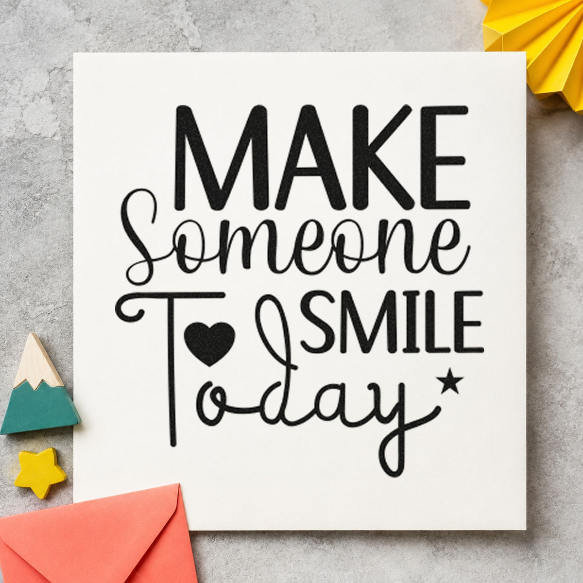 Make Someone Smile Today craft stamp imprint in black ink on a handmade project, one idea being balloon bag gift tags.