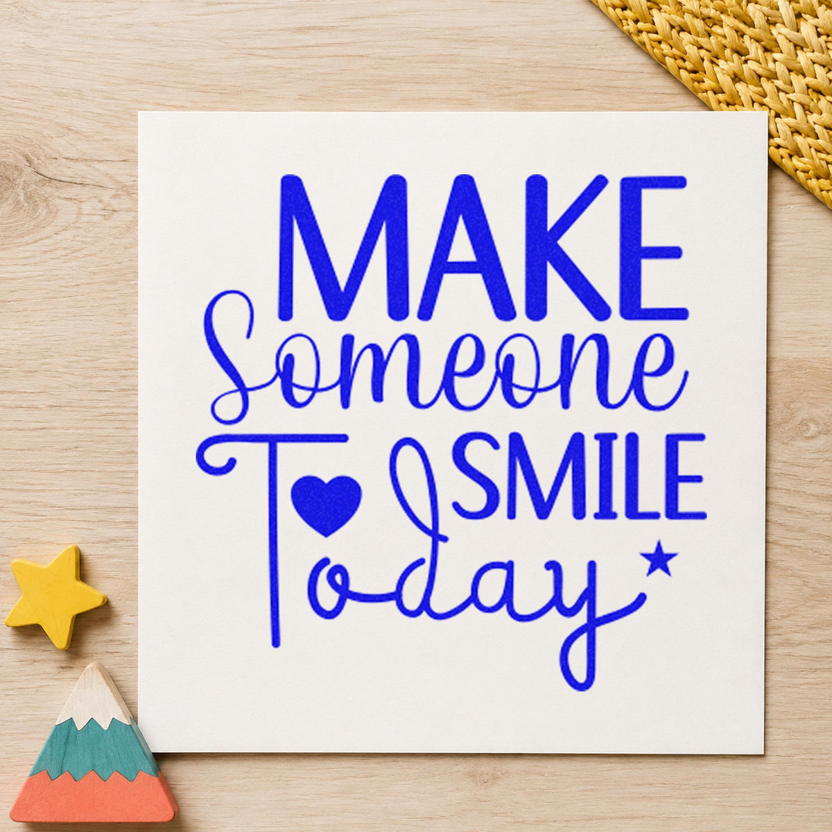 Make Someone Smile Today craft stamp in blue ink on cardstock, an easy option for kit bag printing.