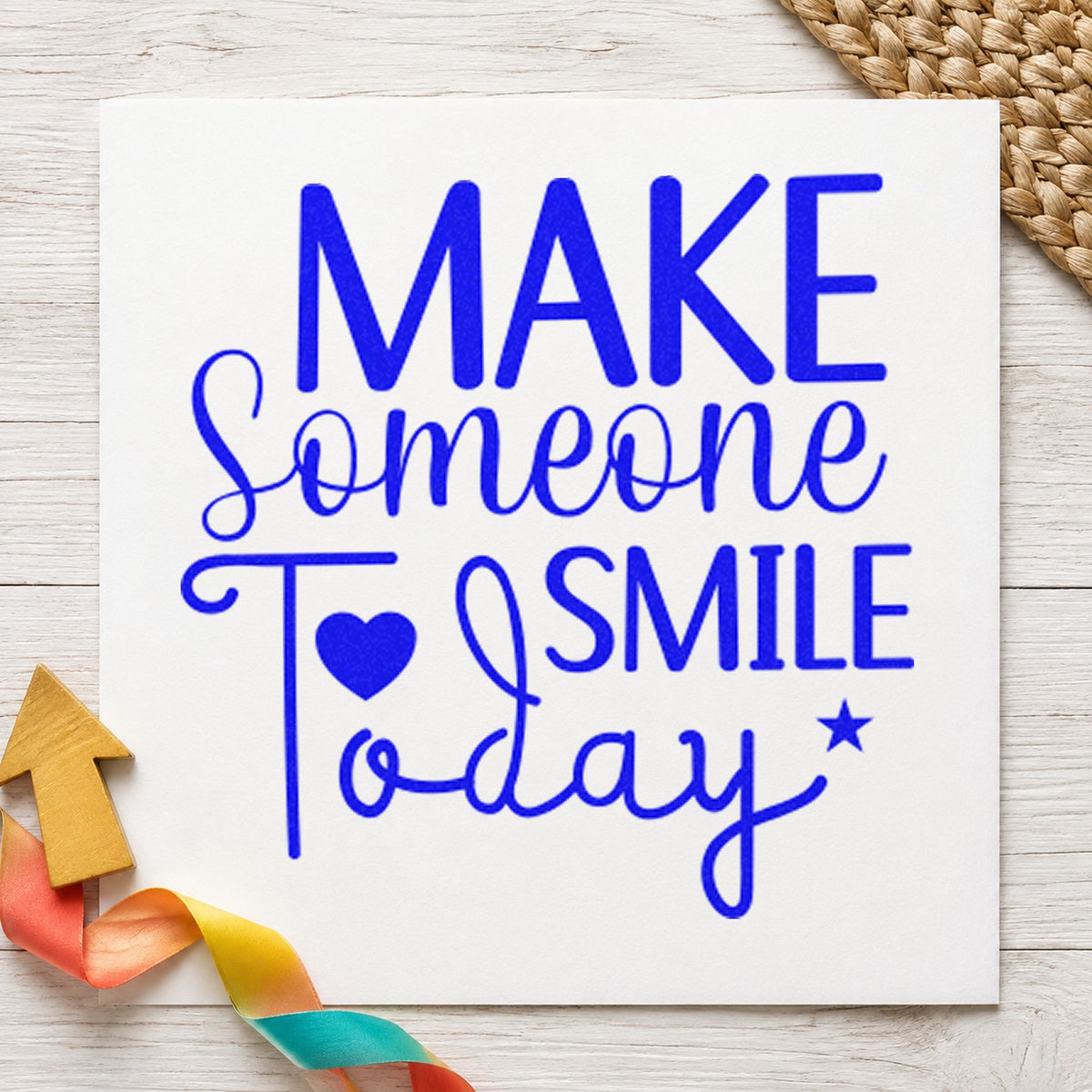Make Someone Smile Today craft stamp imprinted in blue ink on paper, a design suited to framed work studio.